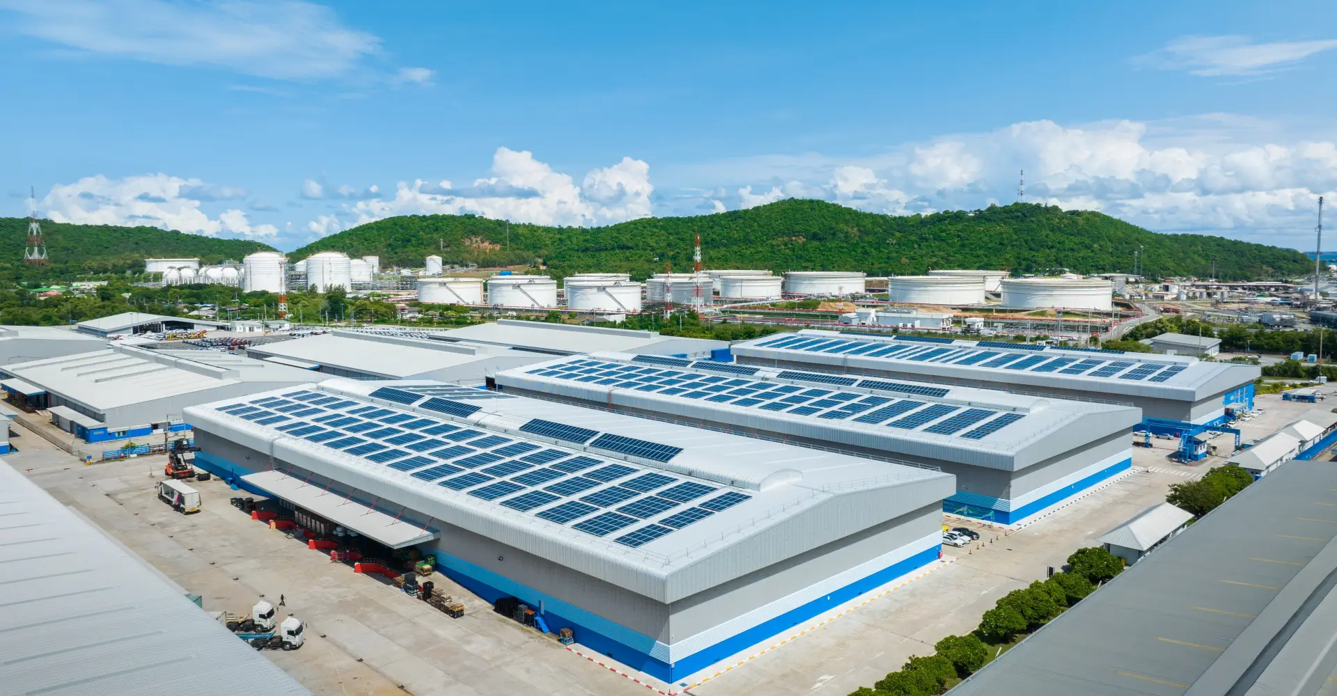 Top view Solar Cell on Warehouse Factory. Solor photo voltaic panels system power or Solar Cell on industrial building roof for producing green ecological electricity. Production of renewable energy.